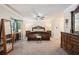 Spacious main bedroom with luxurious furnishings and a ceiling fan at 19 Margrit Ct, Stockbridge, GA 30281