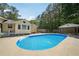 Stunning in-ground pool and poolside cabana in a lush backyard setting at 19 Margrit Ct, Stockbridge, GA 30281