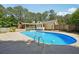Inviting pool surrounded by well-maintained concrete and ample lounge space at 19 Margrit Ct, Stockbridge, GA 30281