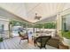Relaxing screened porch with comfortable seating and a view of the pool at 19 Margrit Ct, Stockbridge, GA 30281