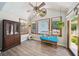 Inviting sunroom with wood-look floors and abundant natural light at 19 Margrit Ct, Stockbridge, GA 30281