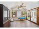 Inviting sunroom with wood-look floors and abundant natural light at 19 Margrit Ct, Stockbridge, GA 30281