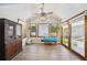 Inviting sunroom with wood-look floors and abundant natural light at 19 Margrit Ct, Stockbridge, GA 30281