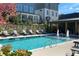 Community pool view with fountain features, lounge chairs, and landscaping at 3316 Stillwood Ln, Atlanta, GA 30354