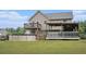 Beautiful backyard with spacious covered deck, upper deck and above-ground swimming pool at 35 Kendall Ln, Covington, GA 30014