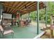Entertaining deck with an outdoor bar, seating, and a backyard view at 35 Kendall Ln, Covington, GA 30014
