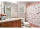 Bathroom featuring a single sink vanity and a toilet with decorative butterfly-themed shower curtain at 35 Kendall Ln, Covington, GA 30014