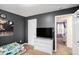 Bedroom showcasing grey walls, modern decor and convenient access to another bedroom at 35 Kendall Ln, Covington, GA 30014