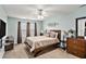 Cozy bedroom featuring a comfortable queen-sized bed, soft carpet, and ample natural light at 35 Kendall Ln, Covington, GA 30014