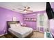 Bright bedroom featuring a full bed, ceiling fan, plush carpet, and shelves for storage at 35 Kendall Ln, Covington, GA 30014