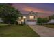 Charming two-story home with a well-maintained lawn, offering a welcoming curb appeal at 35 Kendall Ln, Covington, GA 30014