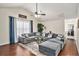 Bright and airy living room featuring a plush sectional sofa and hardwood flooring at 35 Kendall Ln, Covington, GA 30014