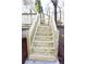 Newly built wooden stairs that provide access to the backyard, with a painted white foundation at 3601 Orchard Cir, Decatur, GA 30032