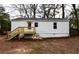 View of backyard with stairs leading up to the back entrance of the home at 3601 Orchard Cir, Decatur, GA 30032