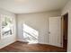 This bright bedroom has a large window to let in the light and laminate flooring at 3601 Orchard Cir, Decatur, GA 30032