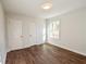 This bedroom has two closets and a view to the outdoors through a window at 3601 Orchard Cir, Decatur, GA 30032
