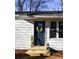 Close-up of a stylish front door with a wreath and a wooden porch at 3601 Orchard Cir, Decatur, GA 30032