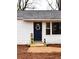 Charming front entrance featuring a navy door with a decorative wreath and plants at 3601 Orchard Cir, Decatur, GA 30032
