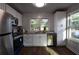 Updated kitchen features stainless steel appliances, granite counters, and bright natural light at 3601 Orchard Cir, Decatur, GA 30032