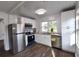 Modern kitchen featuring stainless steel appliances, white cabinets, and hardwood flooring at 3601 Orchard Cir, Decatur, GA 30032