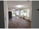 Open floor plan with hardwood floors, a living room, and a modern kitchen at 3601 Orchard Cir, Decatur, GA 30032