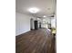 Open living space with hardwood floors connecting to a stylish, modern kitchen at 3601 Orchard Cir, Decatur, GA 30032