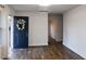 Bright living room with new hardwood flooring and a stylish front door with a wreath at 3601 Orchard Cir, Decatur, GA 30032