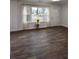 The open living room features great natural light, laminate flooring, and a view of the front yard at 3601 Orchard Cir, Decatur, GA 30032