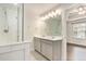 Modern bathroom featuring a double vanity, decorative tile floor, and a glass-enclosed shower with tile surround at 1624 Venture Point Way, Decatur, GA 30032
