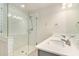 Bathroom featuring a glass-enclosed shower, double vanity, and elegant tile flooring at 1624 Venture Point Way, Decatur, GA 30032