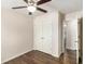 Bedroom featuring a ceiling fan and large closet with double doors, plus wood-look floors at 1624 Venture Point Way, Decatur, GA 30032