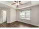 Spacious bedroom with tray ceilings, ceiling fan and plenty of natural light at 1624 Venture Point Way, Decatur, GA 30032