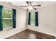 Bedroom with two windows, ceiling fan, and wood-look floors at 1624 Venture Point Way, Decatur, GA 30032