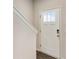View of the home entryway showing the front door and access to the upper level at 1624 Venture Point Way, Decatur, GA 30032