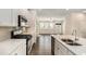 Modern kitchen features stainless steel appliances, quartz countertops, and stylish backsplash at 1624 Venture Point Way, Decatur, GA 30032