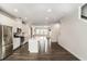 Open floor plan with spacious kitchen, stainless steel appliances, and center island at 1624 Venture Point Way, Decatur, GA 30032