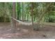 Serene backyard featuring a comfortable hammock strung between mature trees, creating a peaceful retreat at 3521 Eaglerock Dr, Atlanta, GA 30340