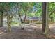 Relaxing backyard scene with a hammock, patio, and well-maintained landscaping, ideal for outdoor enjoyment at 3521 Eaglerock Dr, Atlanta, GA 30340