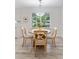 Charming dining area features a round table and chairs, a window view, and wood-look flooring at 3521 Eaglerock Dr, Atlanta, GA 30340