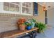 Inviting front porch features potted plants, a wooden bench, and decorative elements creating a welcoming entrance at 3521 Eaglerock Dr, Atlanta, GA 30340