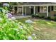 Beautiful front yard with lush greenery and colorful flowers, offering a picturesque view of the home at 3521 Eaglerock Dr, Atlanta, GA 30340