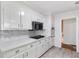 Bright kitchen features white cabinets, mosaic backsplash, and stainless steel appliances at 3521 Eaglerock Dr, Atlanta, GA 30340