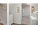 Convenient laundry area near stairs with updated flooring, washer, and easy access to the hall at 3521 Eaglerock Dr, Atlanta, GA 30340