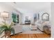 Open living room with hardwood floors, neutral decor, and access to outdoor area at 3521 Eaglerock Dr, Atlanta, GA 30340