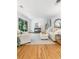 Spacious living room with hardwood floors, neutral decor, and a view of the backyard at 3521 Eaglerock Dr, Atlanta, GA 30340