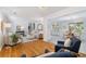 Cozy living room showcasing hardwood floors connecting to the dining and kitchen area at 3521 Eaglerock Dr, Atlanta, GA 30340