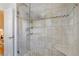 Shower features glass doors, stone-look tile, and built-in shower shelf at 3521 Eaglerock Dr, Atlanta, GA 30340