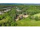 Lush acreage with the home surrounded by green trees in this beautiful aerial photograph at 3805 Carder Ln, Cumming, GA 30028