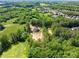 Breathtaking aerial view showcasing a home surrounded by lush greenery and nature at 3805 Carder Ln, Cumming, GA 30028