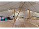 Unfinished attic space with wood beams and insulation, offering potential for customization at 3805 Carder Ln, Cumming, GA 30028